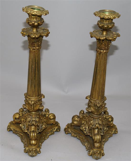 A pair of William IV ormolu candlesticks, 13.5in.